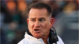 Coastal Carolina deleted a tweet with a photo of Tim Beck shirtless with bikini-clad dancers. See a screenshot of the picture. (Credit: Getty Images)