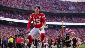 Patrick Mahomes jumping on the field at Arrowhead Stadium in Missouri