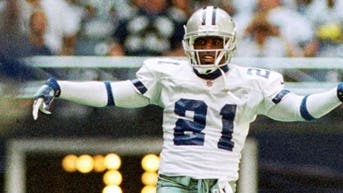 a49952c2-Deion Sanders High-Step Look Back