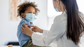 54b0ccef-Boy Receiving a Vaccination During a Pandemic