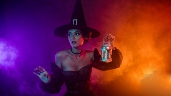 3f84e608-Photo of scared lady in witchery dress solve halloween carnival quest wander lost house isolated bright color background