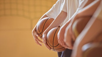 ab62b56b-High school basketball players in gym