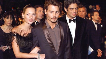 c57d7b6f-US Actors Johnny Depp (C) and Benito Del Toro (R)