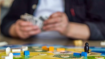 Guy playing a board game