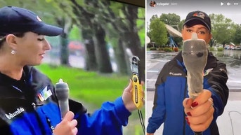 2c743269-Hurricane TV reporter condom microphone