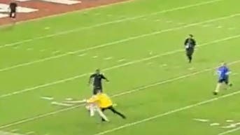 An Alabama Security officer tackled a fan who rushed an empty field following win over Tennessee