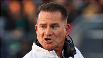 Coastal Carolina deleted a tweet with a photo of Tim Beck shirtless with bikini-clad dancers. See a screenshot of the picture. (Credit: Getty Images)