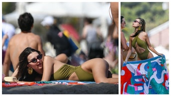 Emily Ratajkowski wears thong to beach.