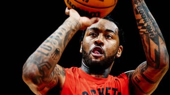 John Wall shoots the ball