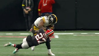 najee-harris-stiff-arm