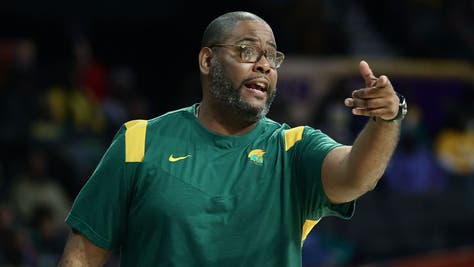 Norfolk State head coach Robert Jones and Illinois State coach Ryan Pedon. The school has opened an investigation into an alleged racial slur yelled at a Norfolk State player
