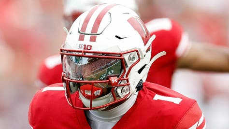 Wisconsin Badgers running back Chez Mellusi will return in 2023. (Photo by John Fisher/Getty Images)