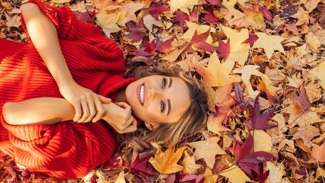 Beautiful woman lying on leaves