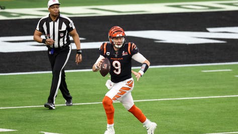 Joe Burrow of the Cincinnati Bengals scrambles and runs as he looks to pass against the Los Angeles Rams during the NFL Super Bowl 56 football game at SoFi Stadium on February 13, 2022 in Inglewood, California.