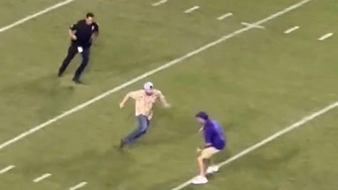 LSU fan rushes the field, while the Tigers destroyed Auburn, with police using perfect tackling form. Via: Preston Guy