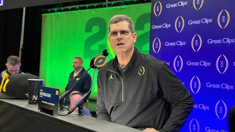Michigan head coach Jim Harbaugh says that student-athletes need their own voice when it comes to revenue sharing with television networks, before the Wolverines play Washington in the college football playoff championship