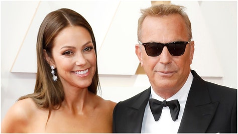 Kevin Costner's estranged wife Christine Baumgartner is vacationing in Hawaii with his friend. Their divorce has been messy. (Credit: Getty Images)