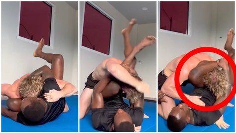 Israel Adesanya dominates Logan Paul in wrestling match. (Credit: Screenshot/Twitter Video https://twitter.com/MichaelBensonn/status/1666111854265921549)