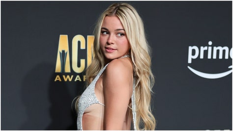 Olivia Dunne posted a viral TikTok video of herself wearing a skimpy bikini while putting her flexibility on display. (Credit: Getty Images)