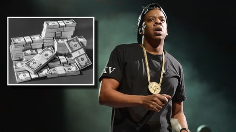 Jay-Z and stacks of money