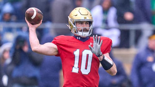 Notre Dame QB Sam Hartman wearing a body part around his neck