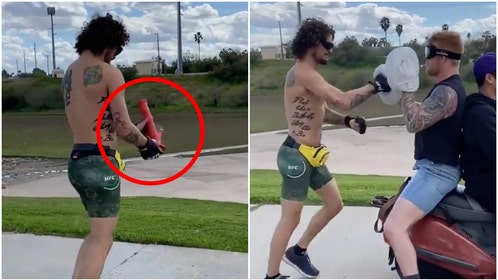 Sean O'Malley hits a bong in workout hype video. (Credit: Screenshot/Twitter Video https://twitter.com/sugaseanmma/status/1715154658950594989)