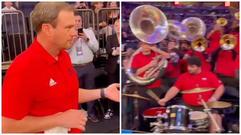 Tom Herman plays air guitar during FAU's Elite Eight win over Kansas State. (Credit: Screenshot/Twitter Video https://twitter.com/FAUAthletics/status/1639761724243935234)