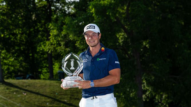 Viktor Hovland with the trophy after winning the 2023 Memorial Tournament at Muirfield Village Golf Club in Dublin, Ohio.