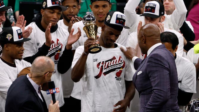 Heat F Jimmy Butler celebrates with the Eastern Conference Finals MVP trophy after beating the Boston Celtics in Game 7.