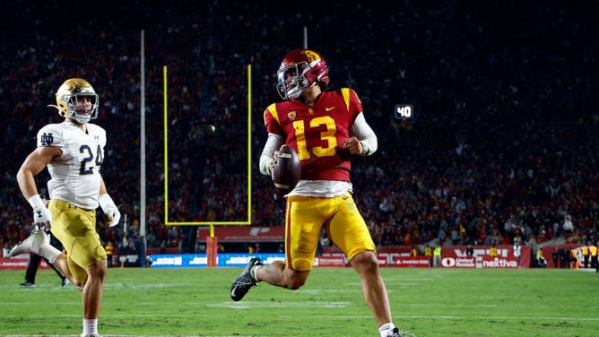 USC Quarterback Caleb Williams running away from the Pac-12