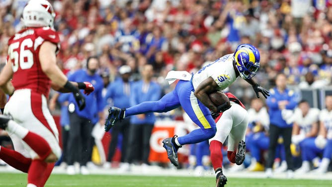 Cam Akers of the Los Angeles Rams leaps during an NFL football game.