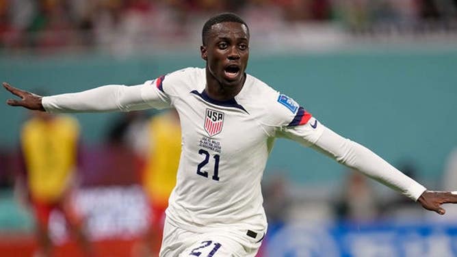 Tim Weah, of the United States, celebrates after scoring during a World Cup Group B soccer match against Wales at the Ahmad Bin Ali Stadium in Doha, Qatar, Monday, Nov. 21, 2022. 