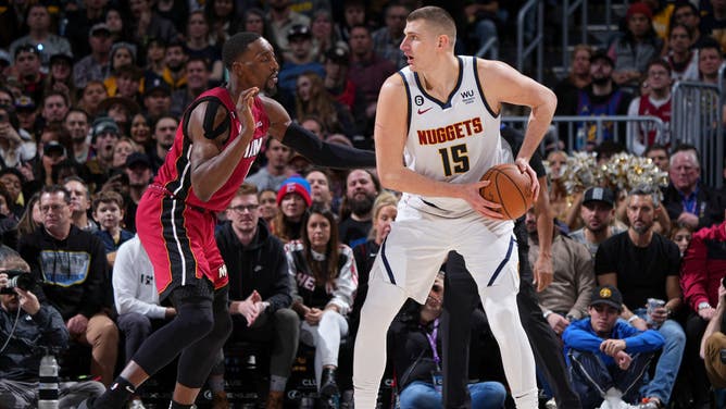 Nuggets big Nikola Jokic operates in the triple threat with Miami Heat big Bam Adebayo playing defense at the Ball Arena in Denver.