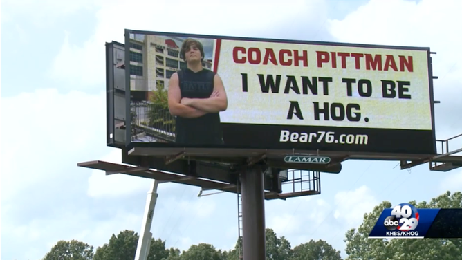 13 year old football player Arkansas billboard