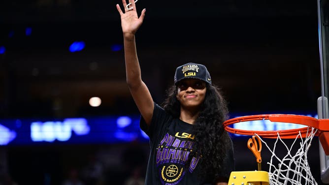 Angel Reese of the Louisiana State Tigers cuts down the net after their win over the Iowa Hawkeyes during the 2023 NCAA Women's Basketball Tournament National Championship.