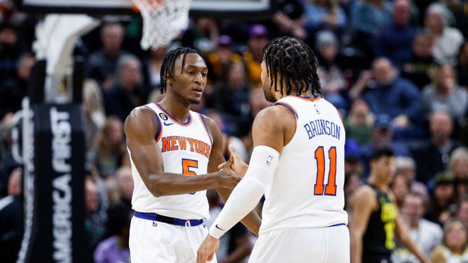 New York Knicks guards Immanuel Quickley and Jalen Brunson dap up against the Utah Jazz at Vivint Smart Home Arena in Salt Lake City, Utah.