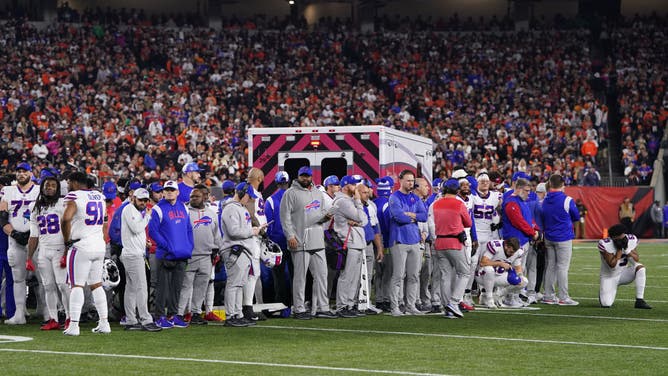 Buffalo Bills players look on after teammate Damar Hamlin collapsed on the field after making a tackle against the Cincinnati Bengals at Paycor Stadium in Cincinnati, Ohio.