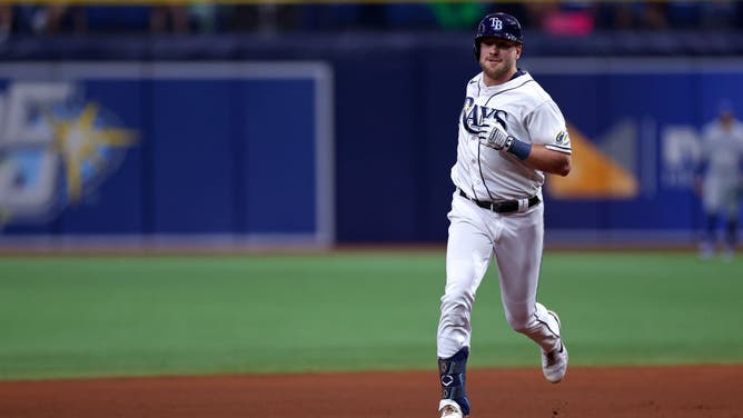 Luke Raley of the Tampa Bay Rays rounds the bases after a solo home run in the seventh inning during a game against the Toronto Blue Jays.