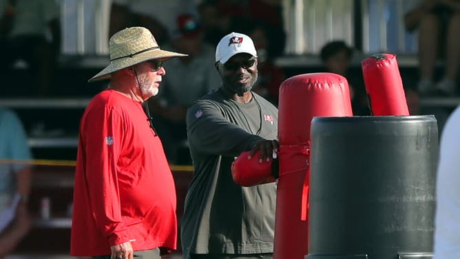 Bruce Arians and Todd Bowles talk during the Tampa Bay Buccaneers Training Camp