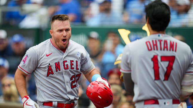 Angels CF Mike Trout  celebrates with DH Shohei Ohtani after hitting a home run vs. the Royals at Kauffman Stadium in Kansas City, Missouri.