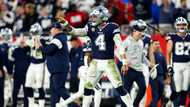 Cowboys QB Dak Prescott celebrates after throwing a TD pass during an NFL wild card playoff football game against the Buccaneers at Raymond James Stadium in Tampa, Florida.