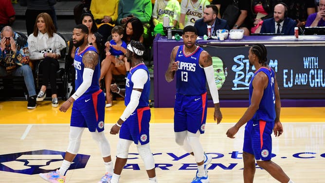Los Angeles Clippers' Marcus Morris Sr., Reggie Jackson, Paul George, and Kawhi Leonard walk on to the court against the Los Angeles Lakers at Crypto.Com Arena in Los Angeles.