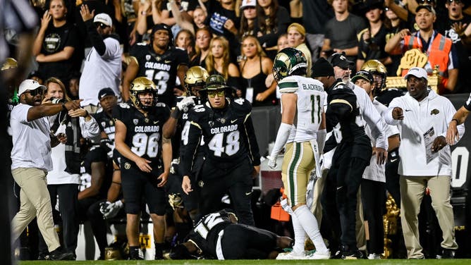 Coaches, teammates, and fans react after wide receiver Travis Hunter #12 of the Colorado Buffaloes was hit near the sideline on a pass attempt by defensive back Henry Blackburn #11 of the Colorado State Rams at Folsom Field on September 16, 2023 in Boulder, Colorado.