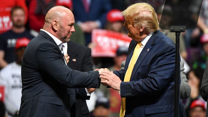 Dana White greets President Donald Trump on stage during a Keep America Great rally on February 20, 2020. (Photo by Michael Ciaglo/Getty Images)