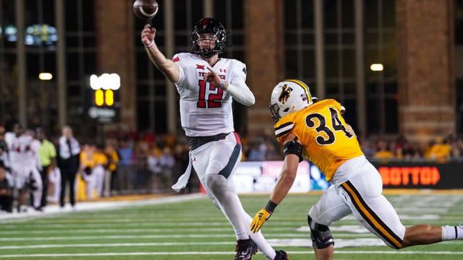 Texas Tech Red Raiders QB Tyler Shough throws a TD in double overtime vs. the Cowboys at Jonah Field at War Memorial Stadium in Wyoming.