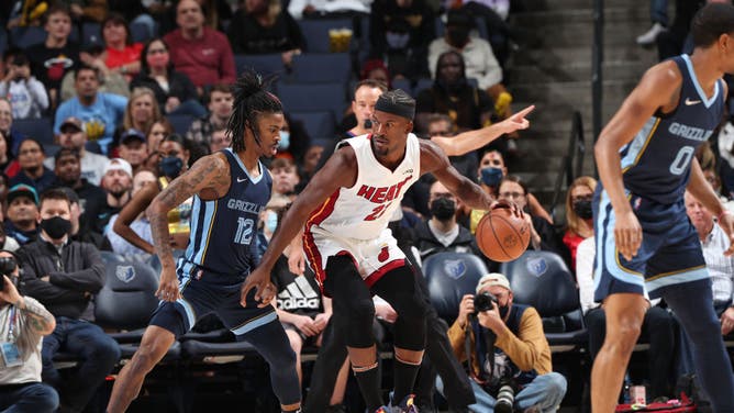 Miami Heat wing Jimmy Butler backs down Memphis Grizzlies PG Ja Morant at FedExForum in Memphis, Tennessee.