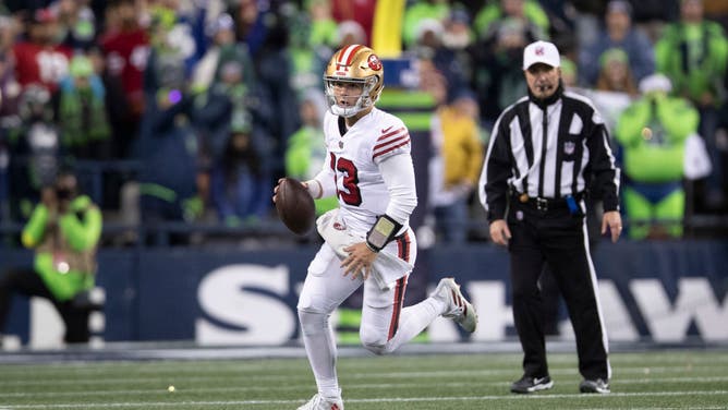 San Francisco 49ers QB Brock Purdy rushes during the game against the Seattle Seahawks at Lumen Field in Seattle, Washington.