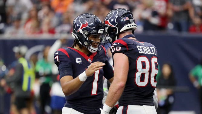 C.J. Stroud of the Houston Texans and Dalton Schultz react after a two-point conversion in the fourth quarter of a game against the Tampa Bay Buccaneers.