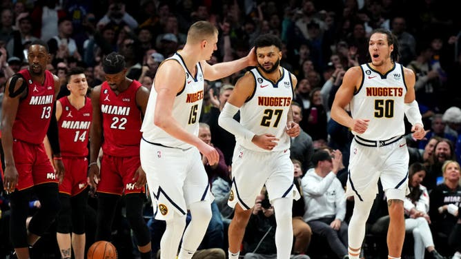 Murray celebrates a bucket with Jokic and Nuggets F Aaron Gordon in the 4th quarter vs. the Heat at Ball Arena in Denver, Colorado.