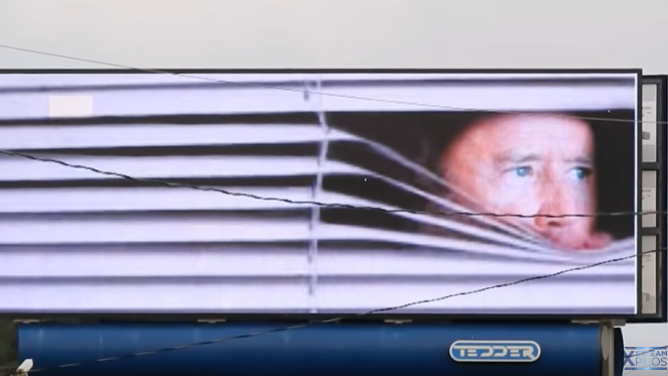 Joe Biden hiding blinds Wilmington North Carolina digital billboard